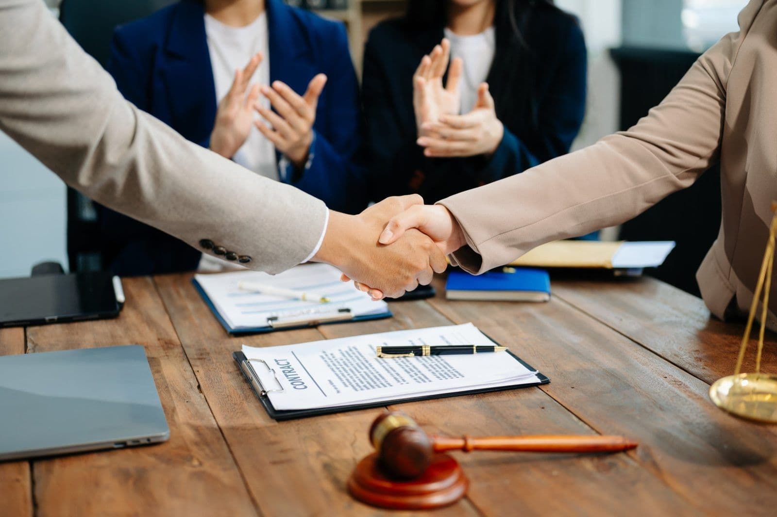 business and lawyers discussing contract papers wi 2025 12 22 14 21 12 utc scaled
