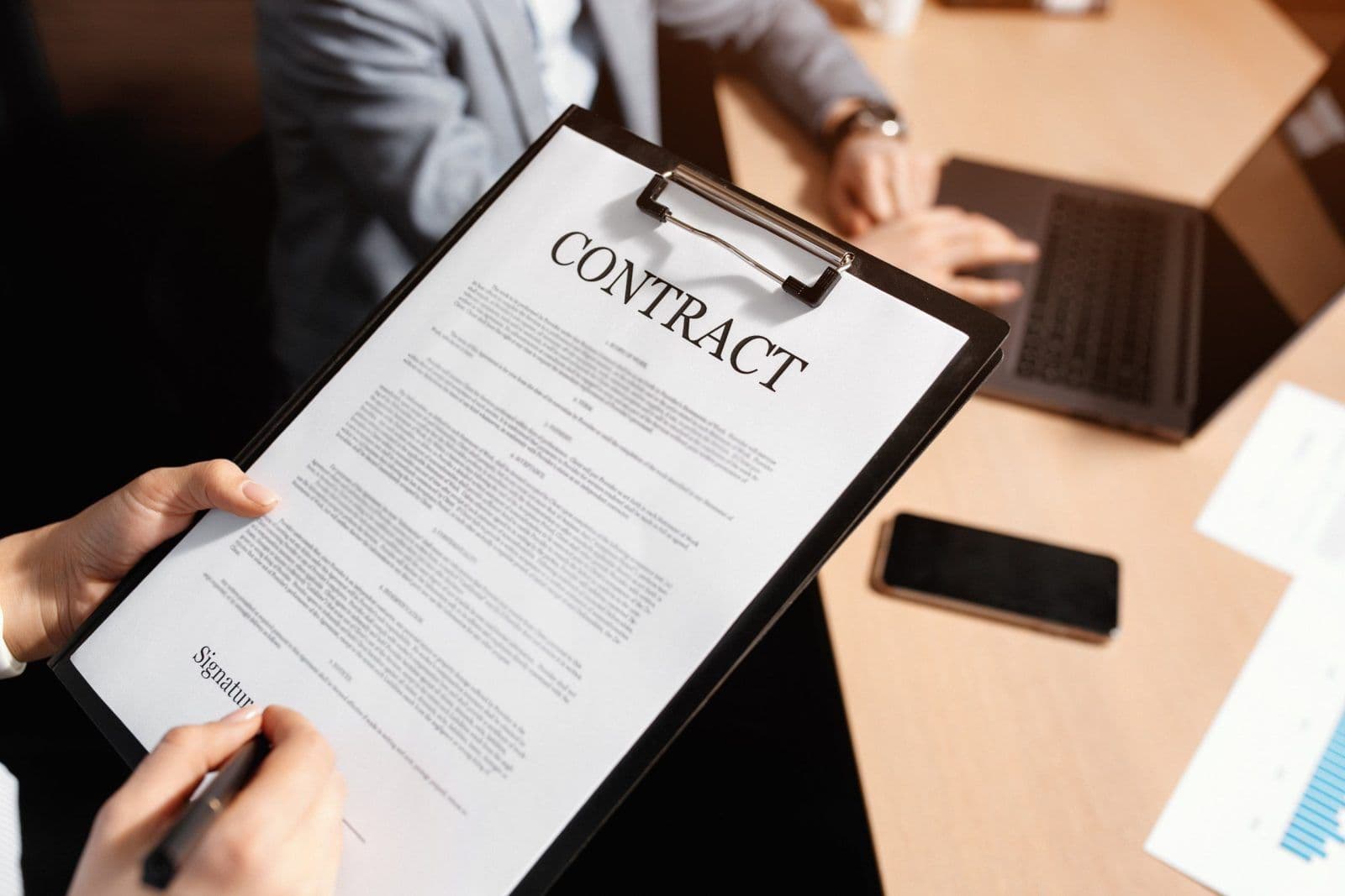 close up photo of business woman and man signing a 2025 04 10 00 26 29 utc scaled